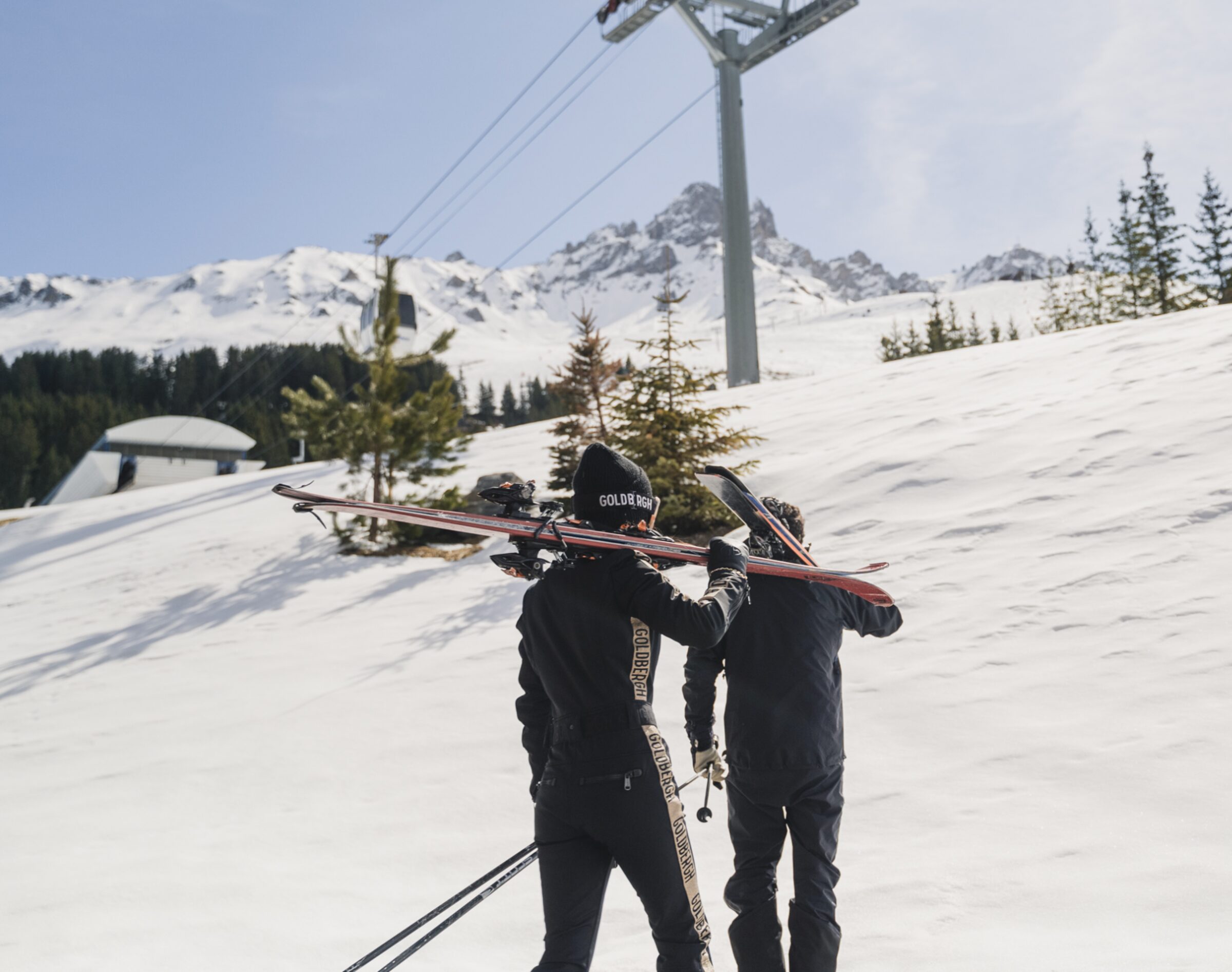 Skiers walking up the mountain, Méribel